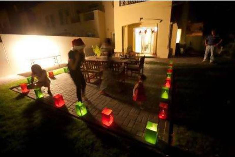 A familiy light up their backyard in Dubai. Mike Young / The National