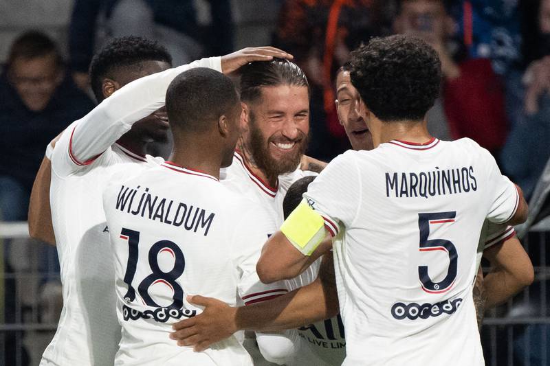 Ramos celebrates with Georginio Wijnaldum and Marquinhos. AFP