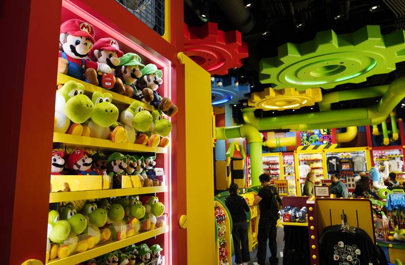 Shoppers browse through Nintendo-themed merchandise in the 1-UP Factory store at the new Universal Studios Hollywood attraction Super Nintendo World. AP