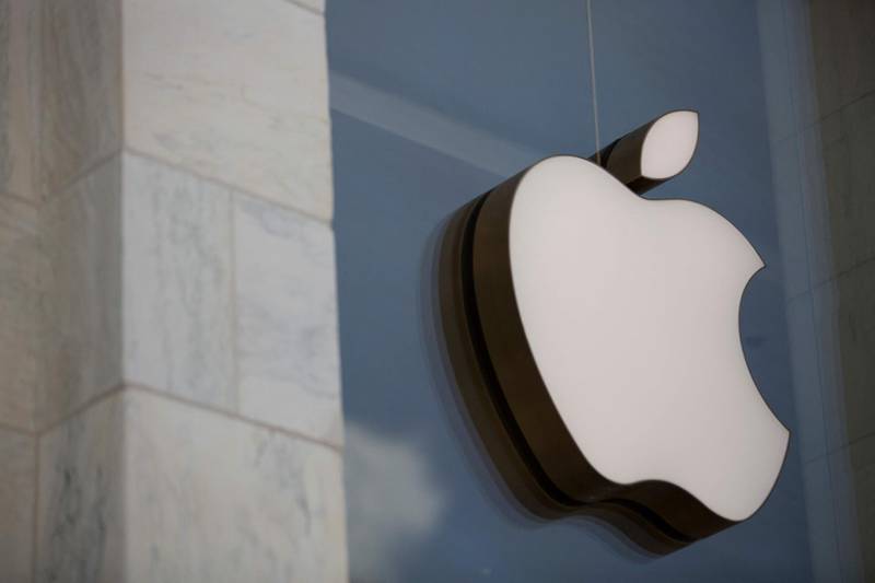 (FILES) In this file photo the Apple logo is seen outside the Apple Store in Washington, DC, on July 9, 2019. Apple announced on April 26, 2021 it plans to boost its investment plans in the United States to $430 billion over the next five years, saying this would add some 20,000 jobs.The updated plan includes more than $1 billion for a new campus and engineering hub in the Research Triangle area of North Carolina.
 / AFP / Alastair Pike
