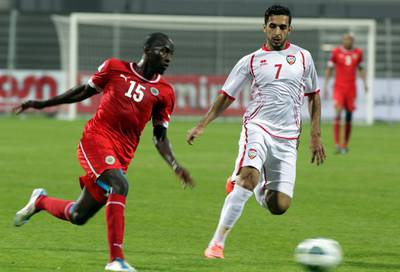 Ahmad Khalil (L) of the United Arab Emirates vies for the ball against Ali Ahmad of the United Arab Emirates during the two teams' match in the 21st Gulf Cup in Manama, on January 8, 2013. AFP PHOTO/ALI AL-SAADI   
 *** Local Caption ***  216262-01-08.jpg