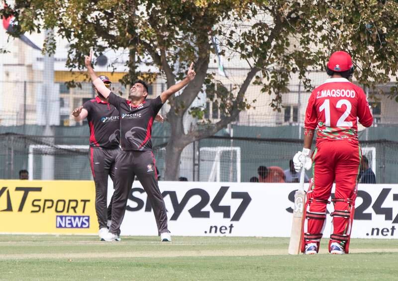 UAE players celebrating taking an Oman wicket during the Cricket World Cup League 2 match at the ICC Academy in Dubai. 