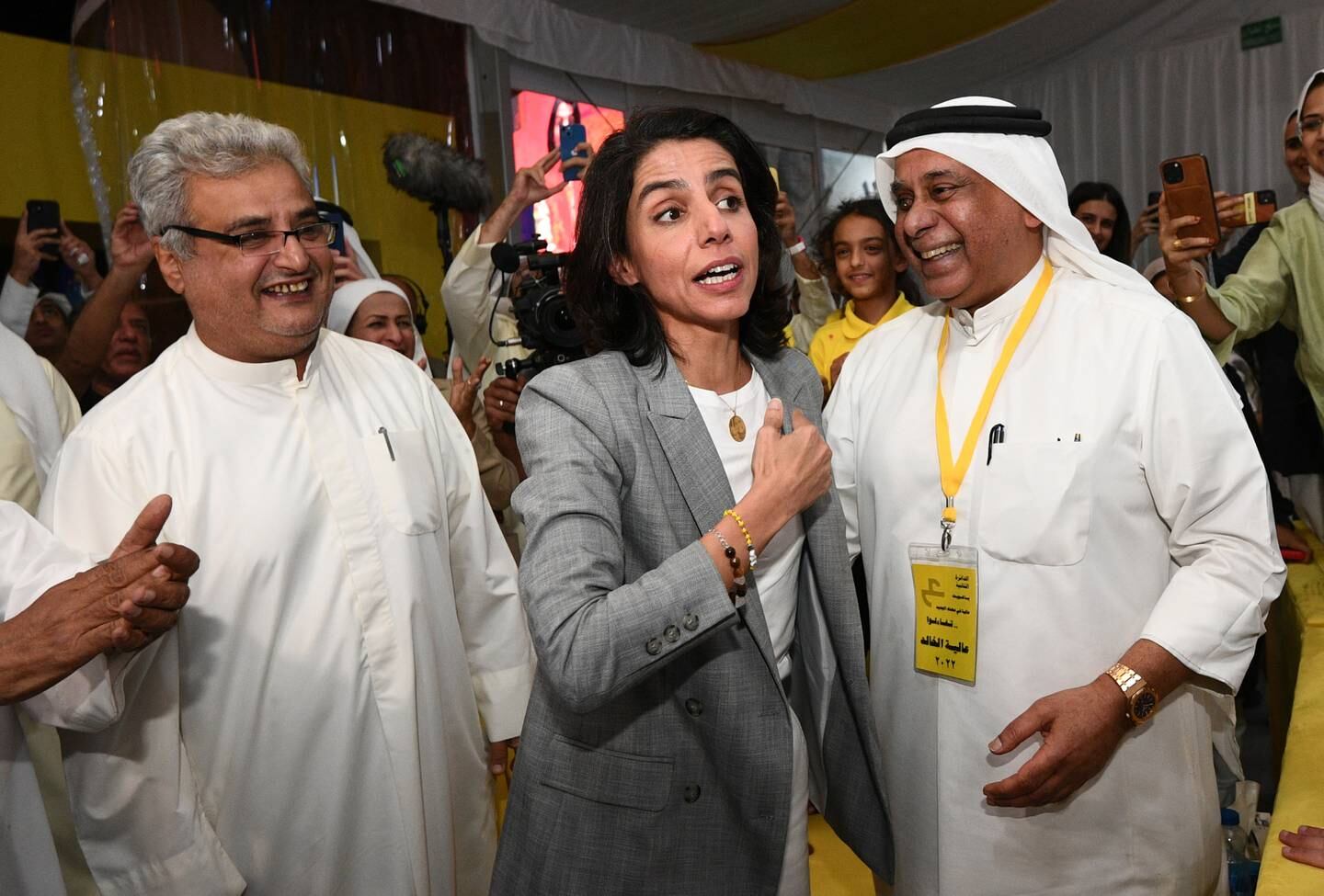 Kuwaiti Candidate Alia AlKhaled (C), celebrates with her supporters after winning in the Kuwaiti parliamentary election in Kuwait City, Kuwait, 30 September 2022. EPA