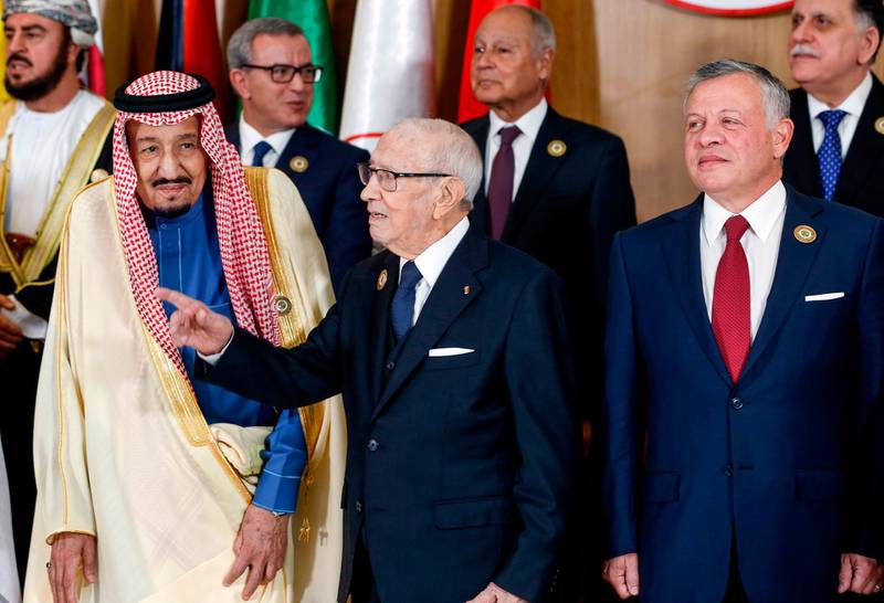 Tunisian President Beji Caid Essebsi (centre) gestures as he stands between Saudi Arabia's King Salman bin Abdulaziz (left) and Jordan's King Abdullah II (right) during the 30th Arab League summit in the Tunisian capital Tunis.  AFP