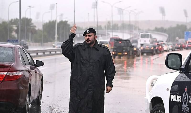 A police officer directs traffic in Muscat. Photo: Royal Oman Police