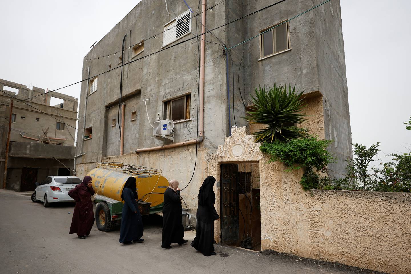 Mourners enter the family home Raed Hazem, a Palestinian from Jenin refugee camp who killed three Israelis after opening fire at a Tel Aviv bar on April 8, 2022.  Reuters