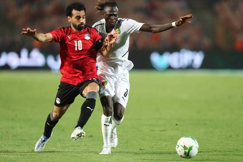 Mohamed Salah tussles with Issiaga Sylla during the Afcon match between Egypt and Guinea in Cairo. EPA