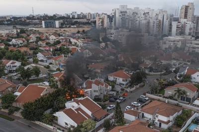 Smoke rises after a rocket fired from the Gaza Strip hit a house in Ashkelon, southern Israel. AP Photo
