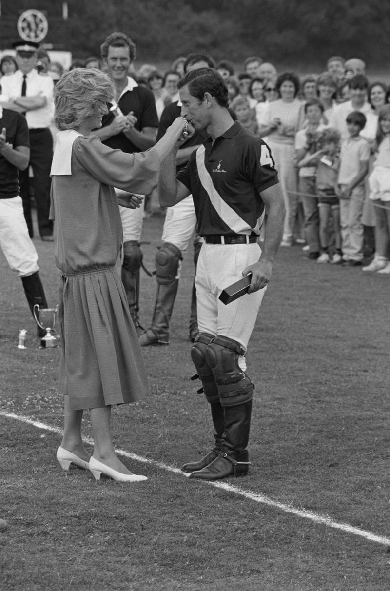 Charles, Prince of Wales hand-kissing Diana, Princess of Wales (1961 - 1997) at Cirencester Polo Club after a polo match, UK, 2nd July 1984. (Photo by Len Trievnor/Daily Express/Hulton Archive/Getty Images)