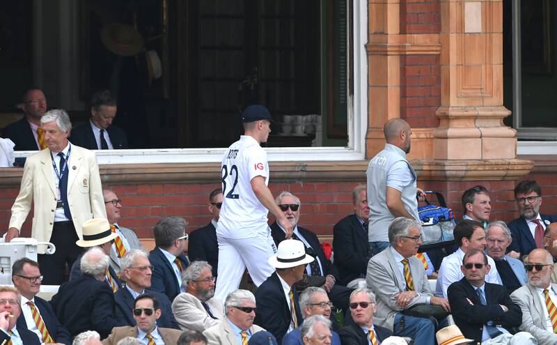 England seamer Matthew Potts walks past MCC members on day one of the first Test against New Zealand at Lord's on June 02, 2022. Getty