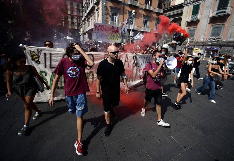 Protesters, including members of Extinction Rebellion and Fridays for Future, march through Naples.