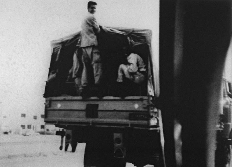 Photograph dated 03 August 1990, showing Iraqi soldiers in a military transport truck in a street of Kuwait city, was released by the official Kuwaiti News Agency office in Beirut 28 August 1990.  AFP PHOTO/KUNA (Photo by KUNA / AFP)