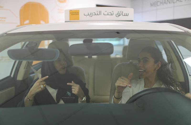 A driving instructor teaches trainee Maria Al Faraj, right, during a  lesson at Saudi Aramco Driving Center in Dhahran, Saudi Arabia. Ahmed Jadallah / Reuters