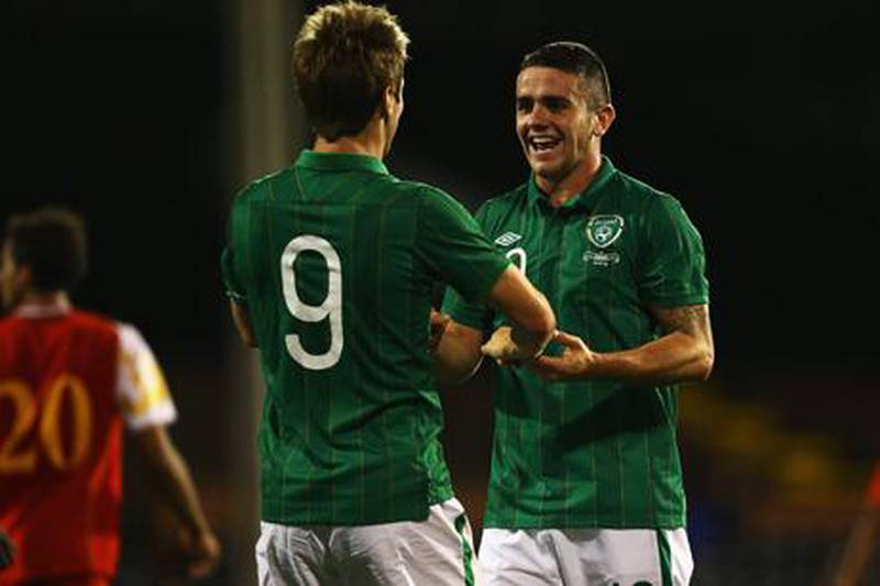 Robbie Brady celebrates with Ireland teammate Kevin Doyle following his debut goal for Ireland against Oman