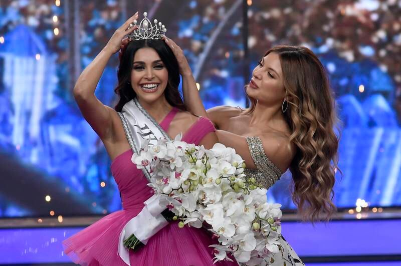 Miss Lebanon 2018 Maya Reaidy crowns Yasmina Zaytoun, winner of the 2022 pageant, in Beirut. EPA