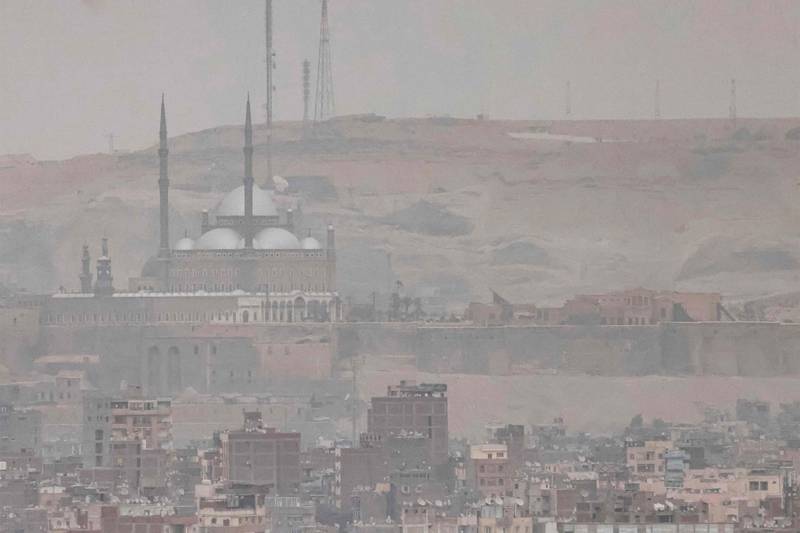 The Mosque of Mohammed Ali and the Cairo Citadel are partially obscured by a sandstorm over Cairo on June 1. AFP 