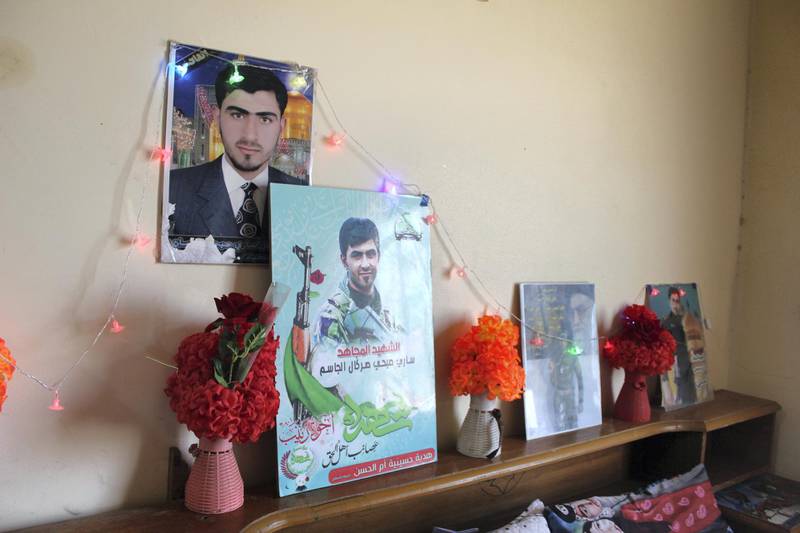 Sahla Al Hasani keeps photographs of her son Sari, who was killed during the military campaign to oust ISIS in 2015. Lizzie Porter/ The National