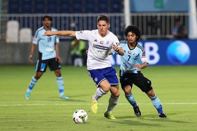 Renan Garcia, left, and his Al Nasr teammates found themselves in a closely marked match with Haboush Saleh Haboush and Baniyas. Al Ittihad