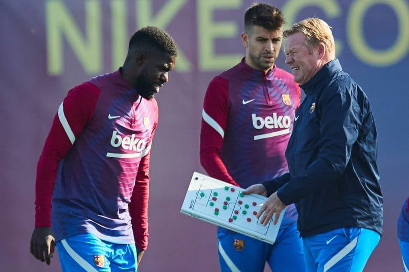 Barcelona manager Ronald Koemam with defender Samuel Umtiti, left, and Gerard Pique  during a training session at Joan Gamper Sports City. EPA