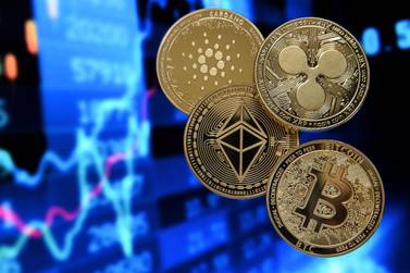 Cryptocurrencies such as Bitcoin, Ethereum, Ripple and Cardano may compete in future with gold as a potential safe-haven asset. Photo: EPA