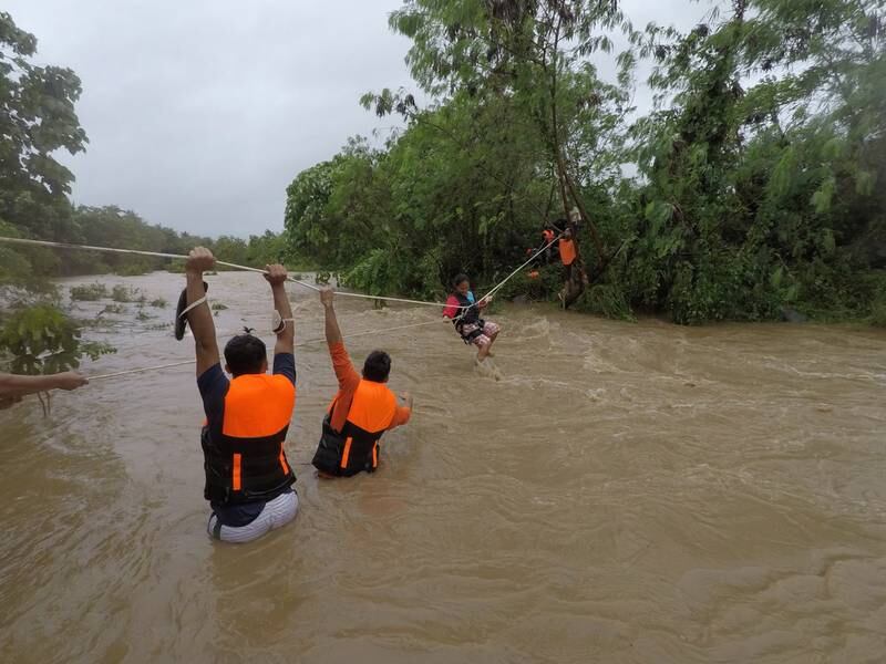 A rescue operation is under way at a flooded village near the town of Gonzaga, Cagayan province, as seen in this photo, made available by the Gonzaga Municipal Disaster Risk Reduction and Management Office. Photo: EPA