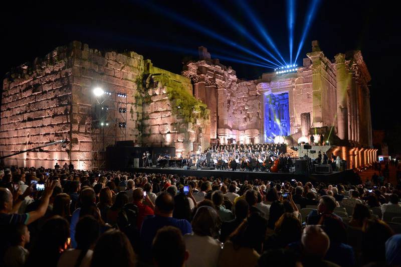 epa07698062 Lebanese Oud musician and singer Marcel Khalife (C) performs on stage at the opening night of the annual Baalbeck International Festival (BIF) in Baalbeck, Beqaa Valley, Lebanon, 05 July 2019. The festival runs from 05 July to 03 August 2019.  EPA/WAEL HAMZEH
