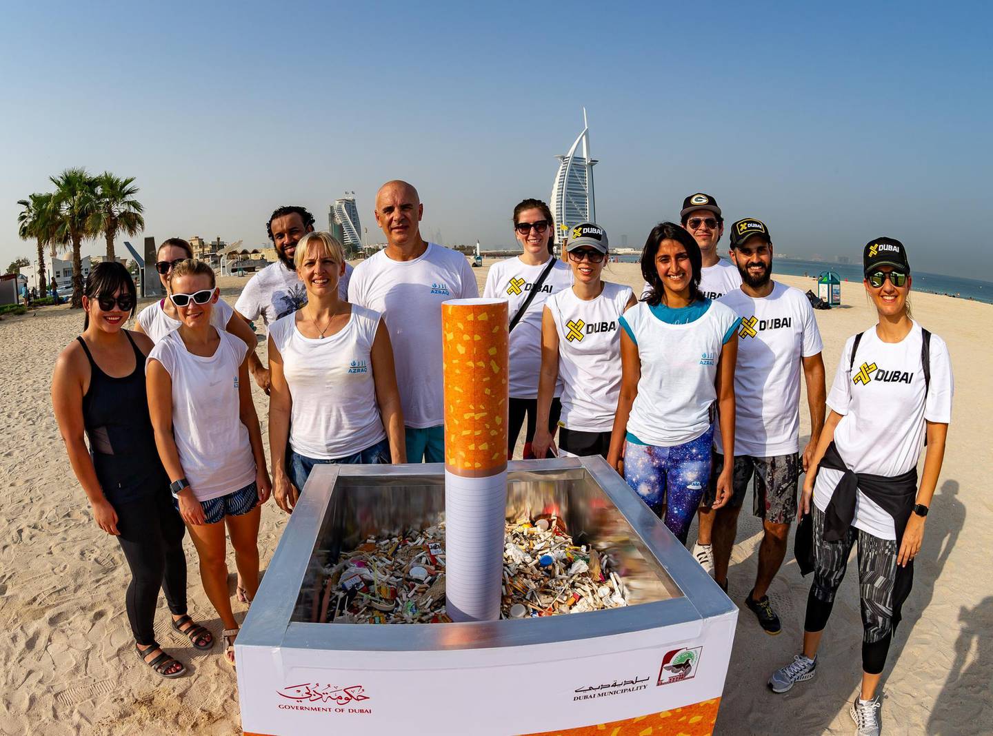 Azraq founder Natalie Banks, front row third from left, with volunteers of a beach clean-up initiative in Dubai. Photo: Azraq