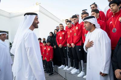 ABU DHABI, UNITED ARAB EMIRATES - December 23, 2019: HH Sheikh Mohamed bin Zayed Al Nahyan, Crown Prince of Abu Dhabi and Deputy Supreme Commander of the UAE Armed Forces (2nd L) speaks with members of Asian Muay Thai Championship 2019, during a Sea Palace barza. Seen with Abdullah Saeed Al Neyadi, Chairman of the UAE Muay Thai & Kickboxing Federation (L).

( Mohamed Al Hammadi / Ministry of Presidential Affairs )
---