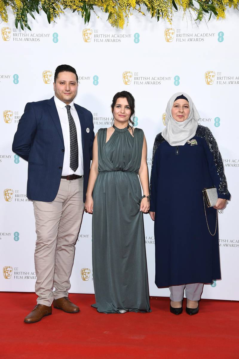 Hamza al-Kateab, Waad Al-Kateab and Afraa Hashem attend the Bafta - EE British Academy Film Awards 2020 Nominees' Party at Kensington Palace on Saturday, February 1. Getty Images