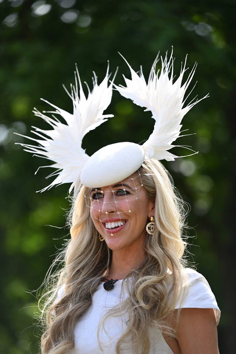 A dramatic white hat with horn-like embellishment. AFP