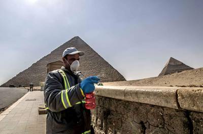 Egyptian municipality workers disinfect the Giza pyramids as a protective measure against the spread of the coronavirus. The country reopened to tourists on July 1. AFP