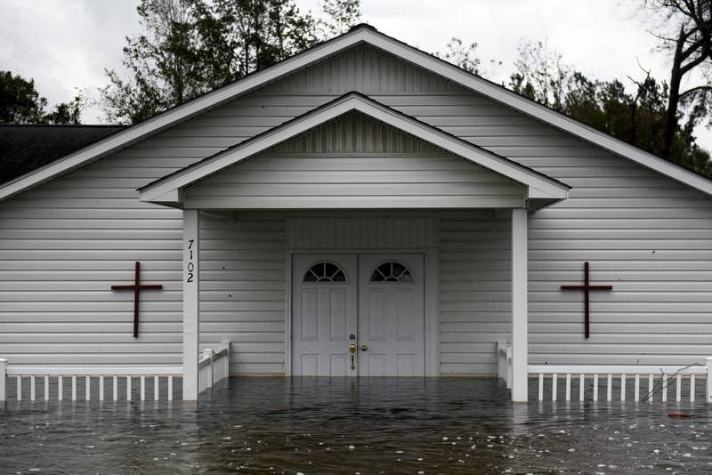 A church stands partially submerged in floodwaters during Tropical Storm Florence in Richlands, North Carolina. Bloomberg
