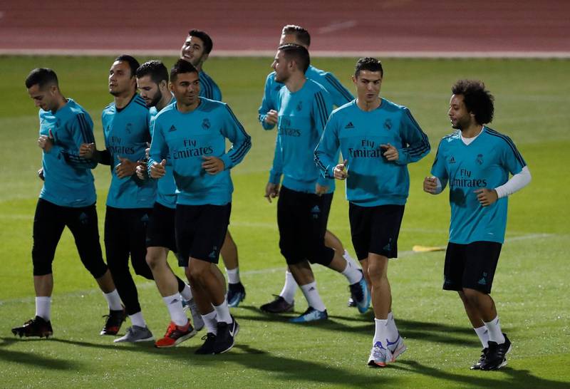 Real Madrid's Cristiano Ronaldo and Marcelo with teammates during training. Matthew Childs / Reuters