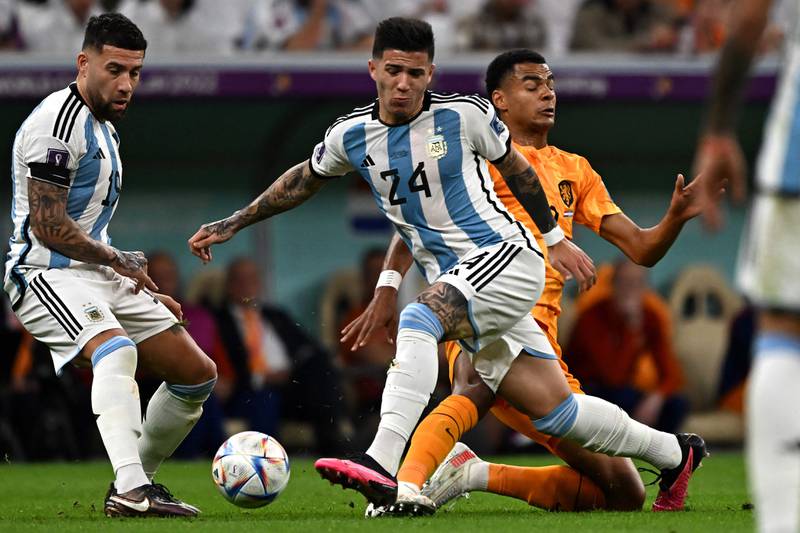 Argentina's Enzo Fernandez is challenged by Netherlands defender Jurrien Timber during the World Cup quarter-final at Lusail Stadium, on December 9, 2022. AFP