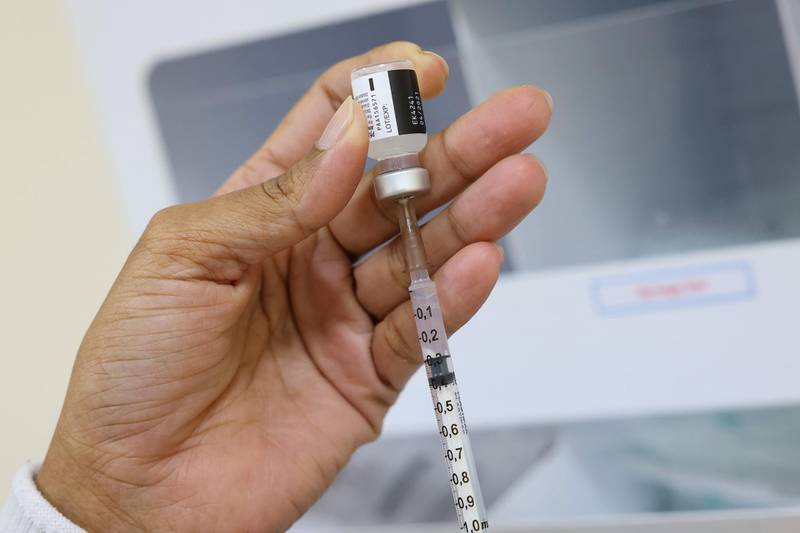 A nurse prepares a dose of the Pfizer-BioNTech vaccine at al-Barsha Health Centre in Dubai. AFP