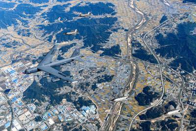 A US Air Force bomber flies alongside South Korean Air Force fighter jets in a joint drill in South Korea. AFP