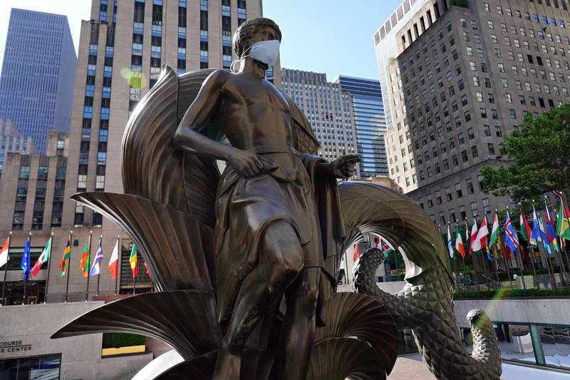 Paul Manship's 'Youth' statue in Rockefeller Centre wears a mask to coincide with New York City moving into the phase two of gradual reopening from coronavirus restrictions. AFP