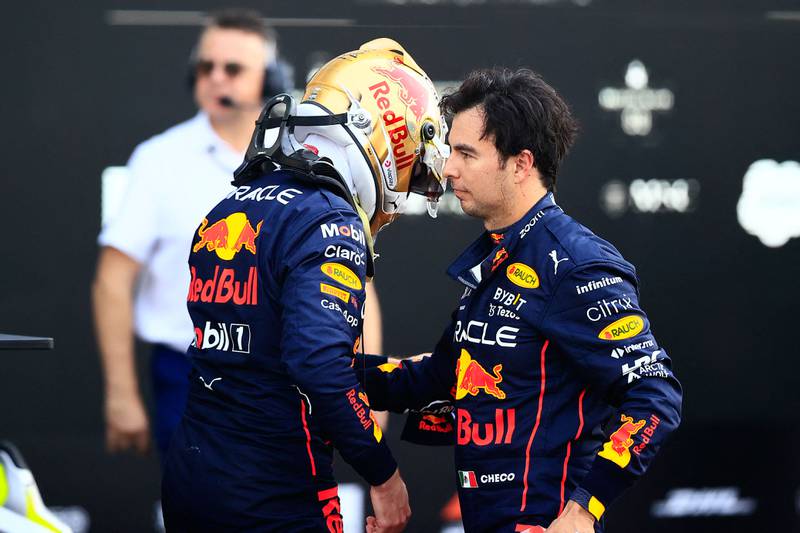 Max Verstappen is greeted by his teammate Sergio Perez after taking pole position for the Formula One Mexico Grand Prix. AFP