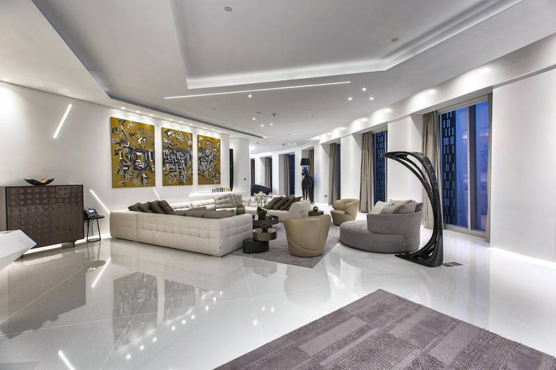 The angular lounge with the horse lamp in the background.   Courtesy LuxuryProperty.com