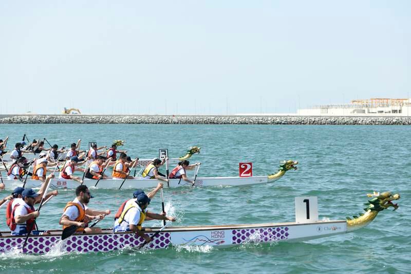 The Hong Kong Economic Trade Office team, centre, race against Waterfront Market, DP World 2 and Cortex at the Hong Kong Dragon Boat Festival.