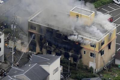 An aerial view shows firefighters battling fires at the site where a man started a fire after spraying a liquid at a three-story studio of Kyoto Animation Co. in Kyoto, western Japan, in this photo taken by Kyodo, July 18, 2019. Mandatory credit Kyodo/via REUTERS ATTENTION EDITORS - THIS IMAGE WAS PROVIDED BY A THIRD PARTY. MANDATORY CREDIT. JAPAN OUT. NO COMMERCIAL OR EDITORIAL SALES IN JAPAN.