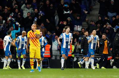Espanyol's Wu Lei celebrates scoring their second goal with teammates as Barcelona's Jordi Alba and Luis Suarez look dejected. Reuters