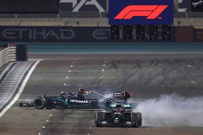 Mercedes' Finnish driver Valtteri Bottas and teammate Lewis Hamilton do doughnuts after the race.  AFP