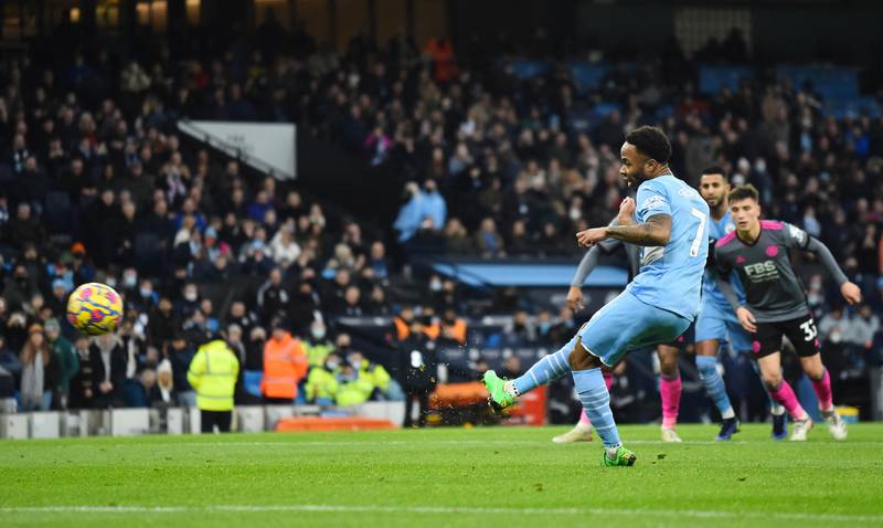 City's Raheem Sterling scores their fourth goal from the penalty spot. Reuters