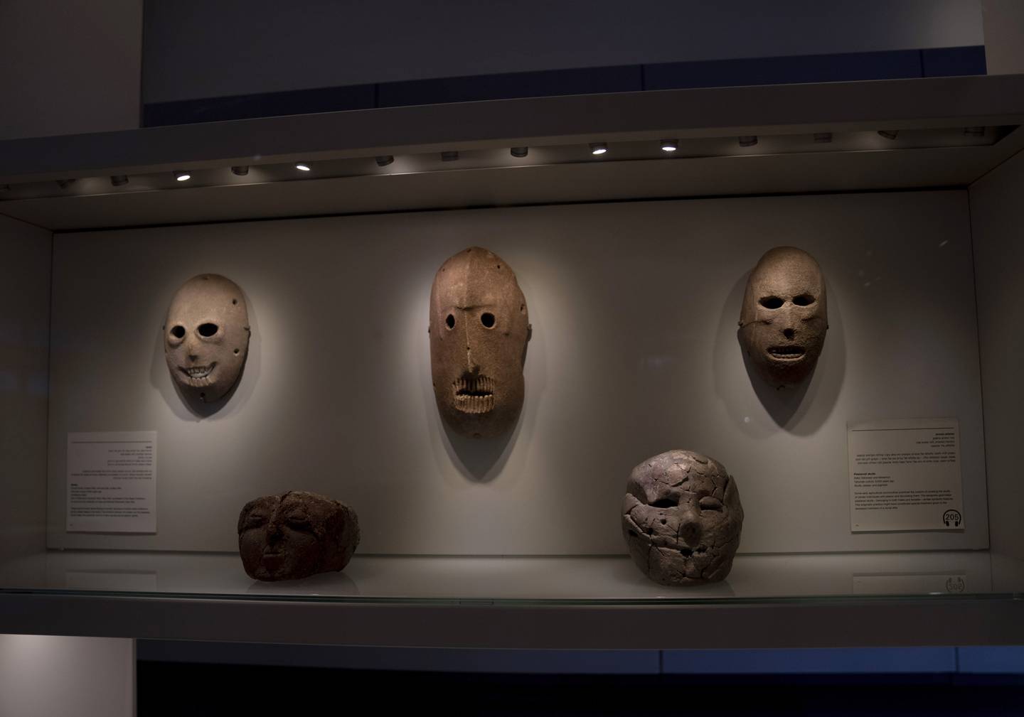 A Neolithic mask (C) loaned by Michael Steinhardt is displayed at the Israel Museum in Jerusalem. AP