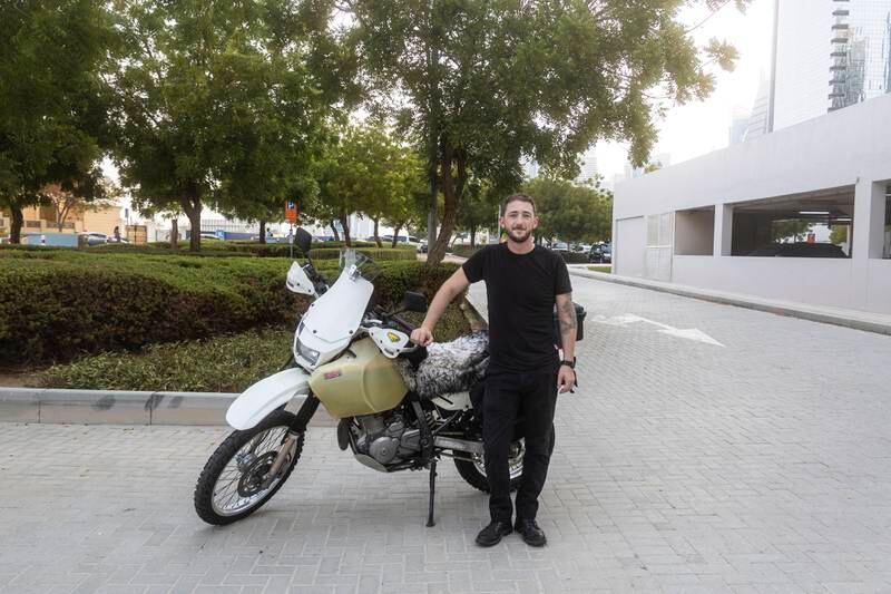Evan Bourke with the bike he will be travelling on from Dubai to Ireland. Photo: Evan Bourke