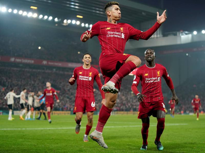 Roberto Firmino celebrates after a goal before it gets disallowed by VAR. AP Photo