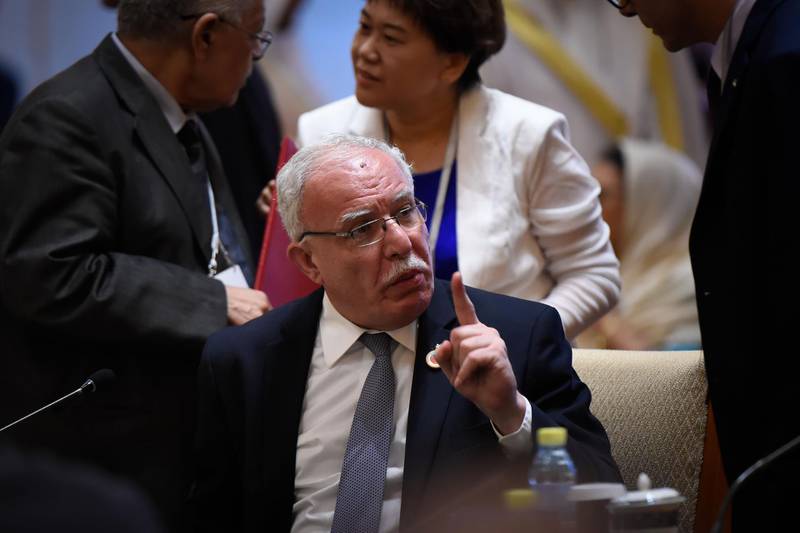 Palestinian Foreign Minister Riyad al-Maliki speaks with Palestinian representatives before the ministerial meeting. AFP