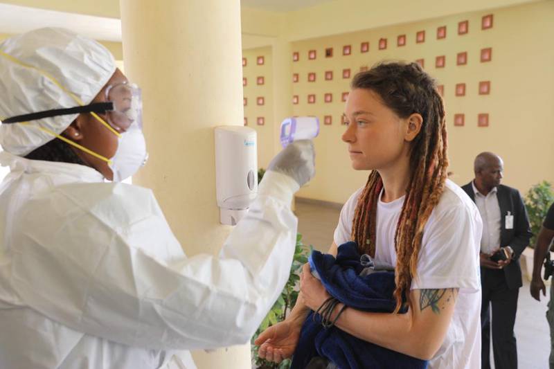 Canadian Edith Blais, who was released after being kidnapped by extremists while travelling in Burkina Faso, has her temperature taken due to coronavirus preventive measures. MINUSMA, HO
