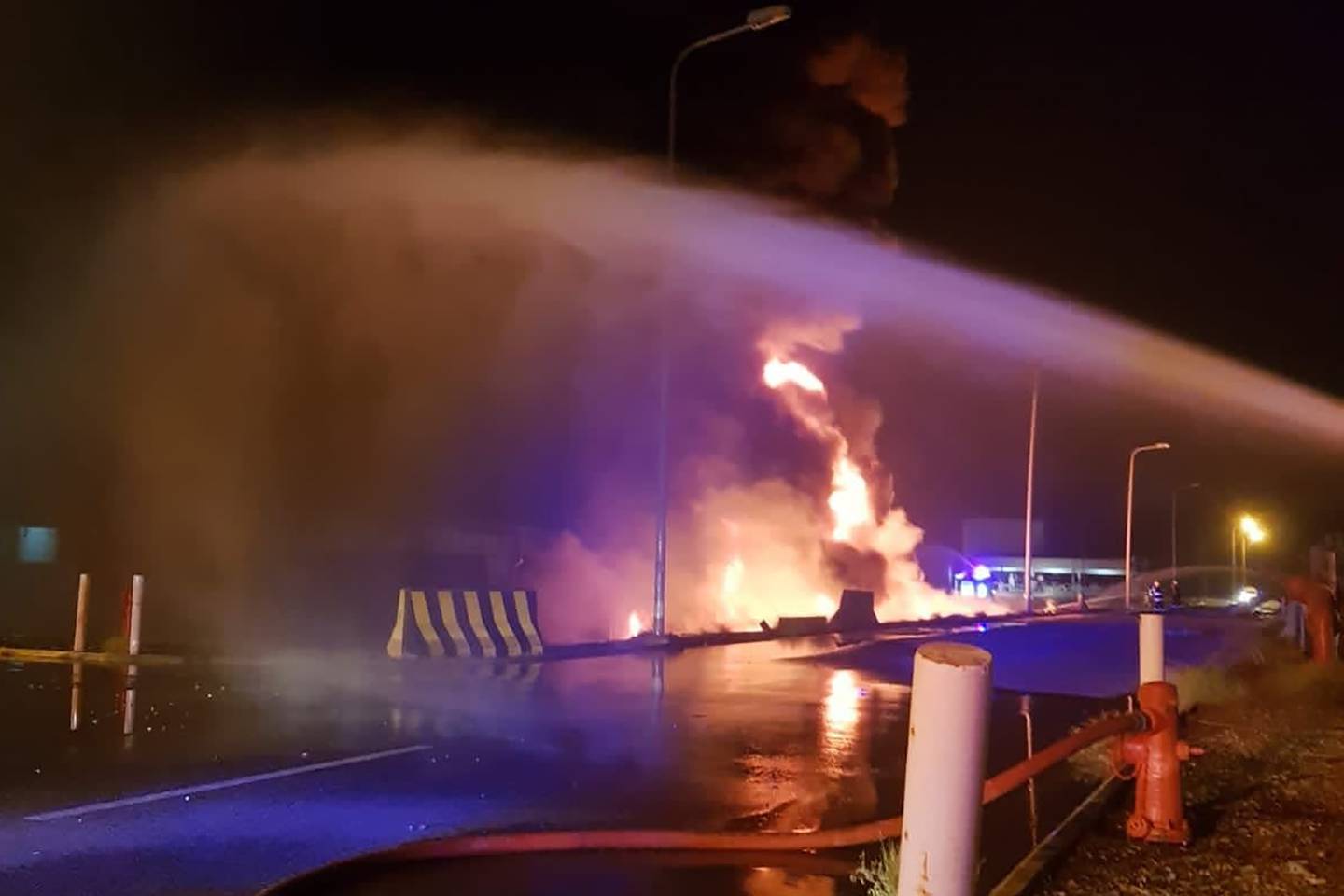 Firefighters try to extinguish a blaze at an Aramco terminal in Jizan. SPA